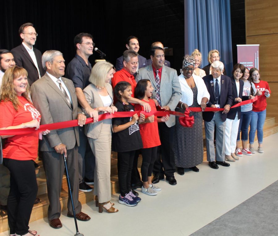CCISD School Board members and other dignitaries participate in the ribbon-cutting for the new Baker Middle School building on October 10.