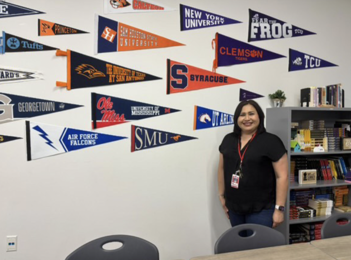 One of the most prominent decorations in Ray High School English teacher
Ruth Whitmore’s room is her wall displaying college pennants gifted by many students across the years. Whitmore prepares students with a rigorous course load and active learning.