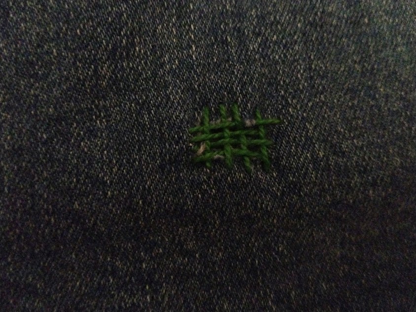 My first attempt at darning. The embroidery floss needs to be closer together, but it isn’t too bad for a first try and you can see the effect it’s trying to create. 