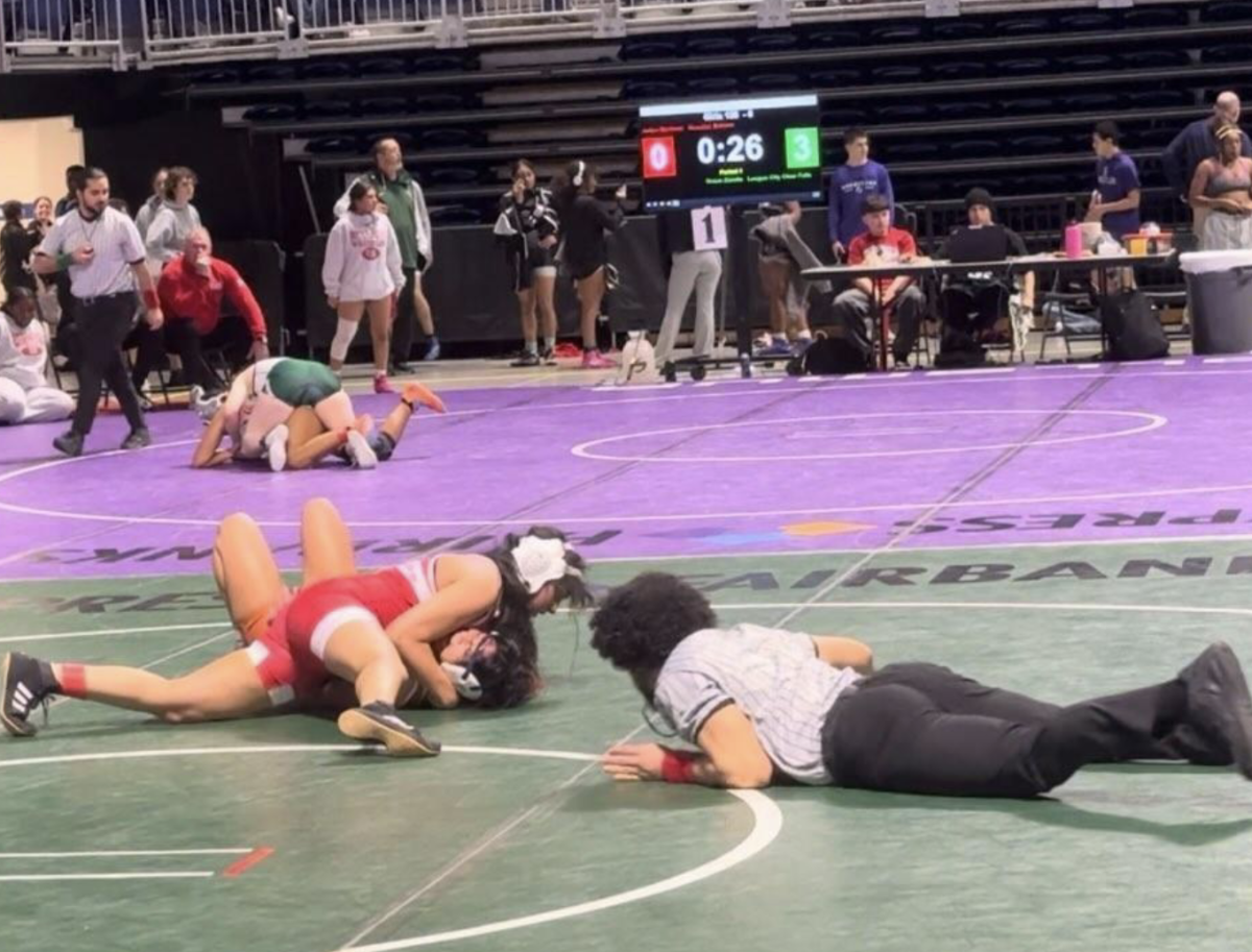 Chandrika Pallekonda pinning an opponent at the CyFair wrestling tournament a month prior to tearing her MCL.